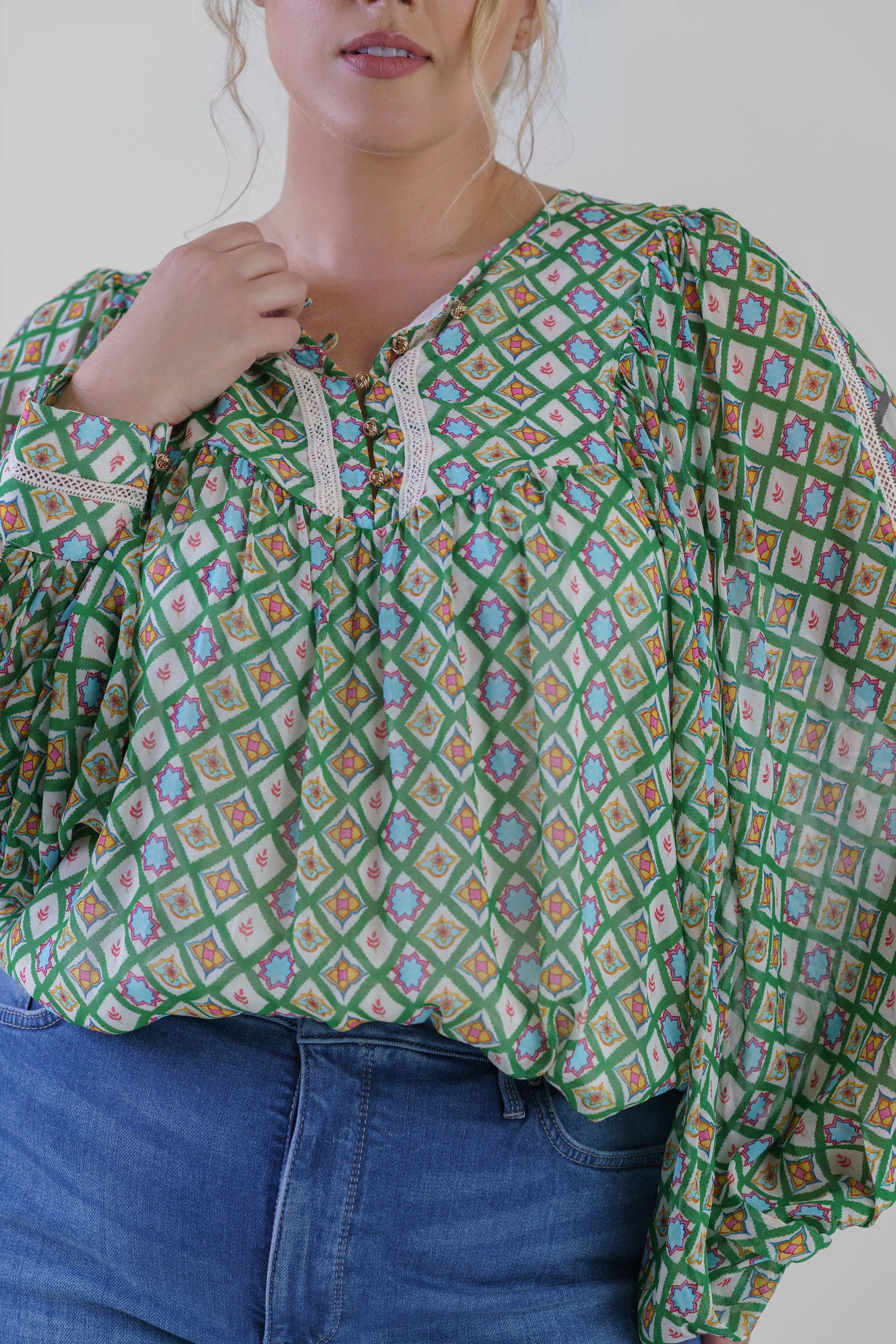 woman wearing luxury plus size top 