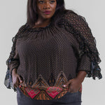 Plus size, gathered neck, long sleeves with a ruffle detail throughout the length