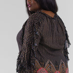 Plus size, gathered neck, long sleeves with a ruffle detail throughout the length