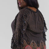 Plus size, gathered neck, long sleeves with a ruffle detail throughout the length