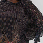 Plus size, gathered neck, long sleeves with a ruffle detail throughout the length