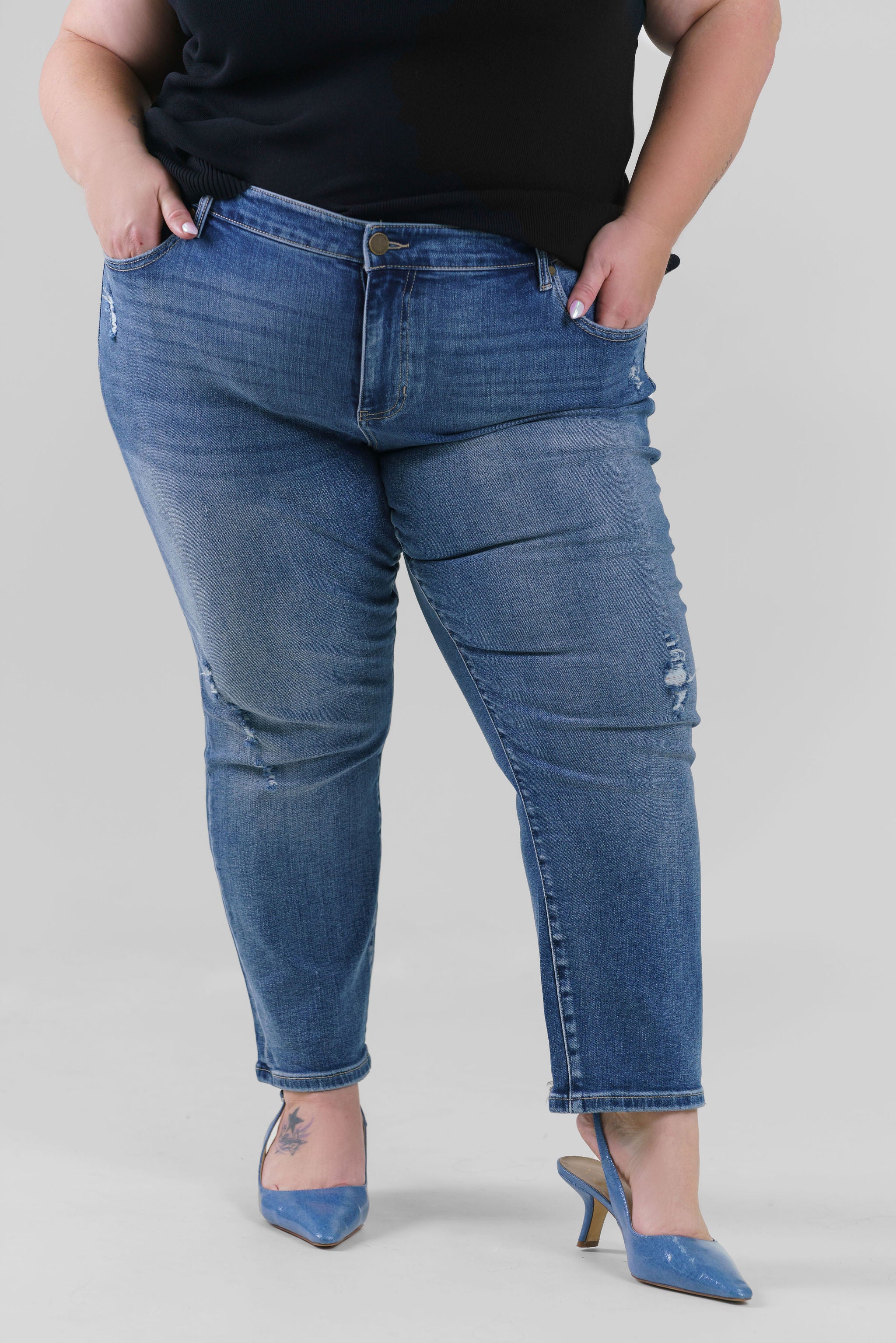 Plus size denim, destruction finish at the back hem