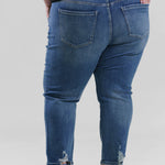 Plus size denim, destruction finish at the back hem