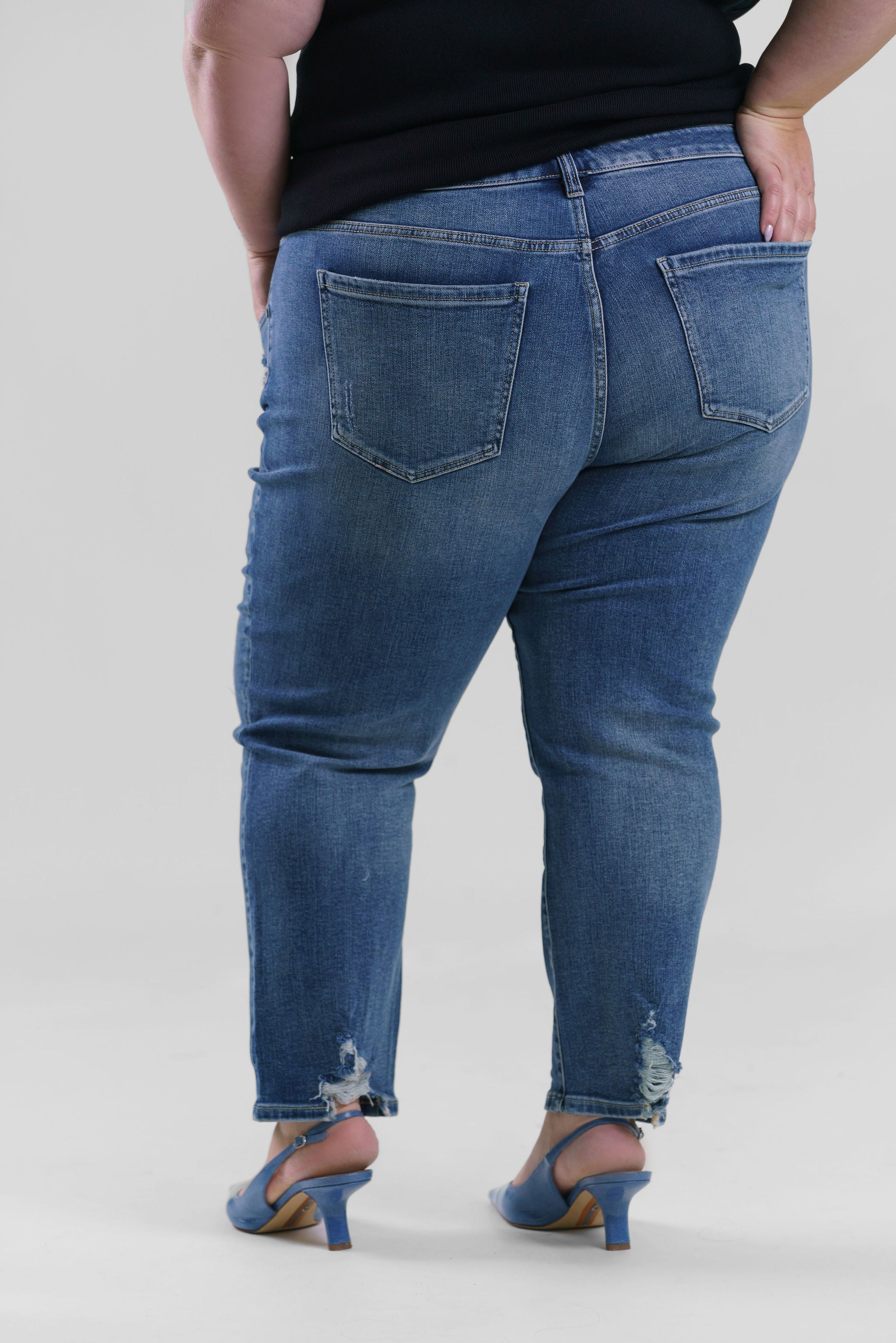 Plus size denim, destruction finish at the back hem